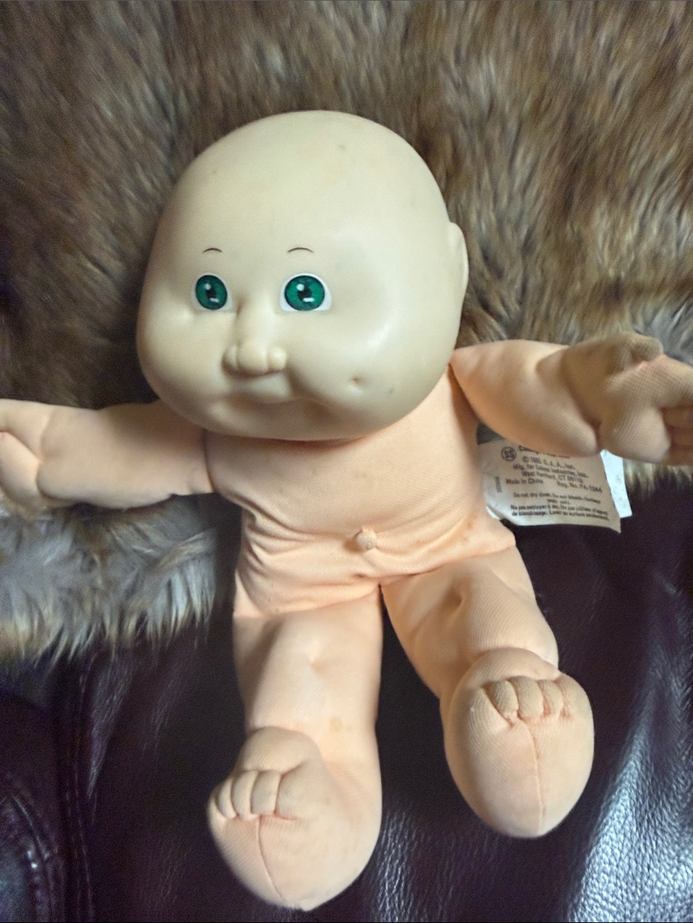 Plush Peach Baby Doll with Green Eyes